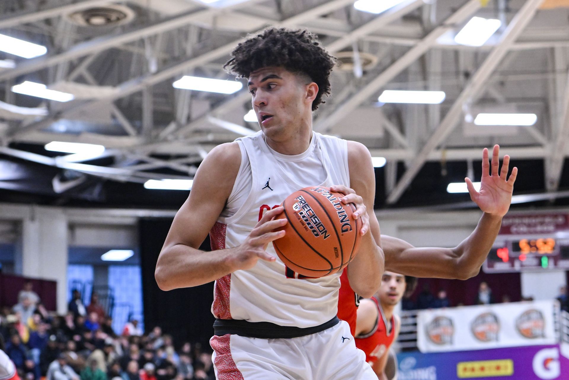 Cameron Boozer of Christopher Columbus (#12) looks to pass the ball during the first half of the Explorers&#039; Spalding Hoophall Classic high school basketball game against Long Island Lutheran on January 13, 2024, at Blake Arena in Springfield, MA. Photo: Getty