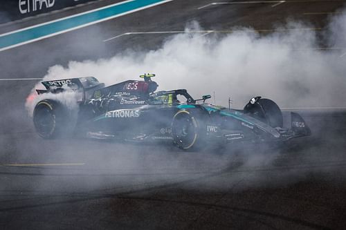 Lewis Hamilton performs donuts after completing the race in Abu Dhabi - Source: Getty