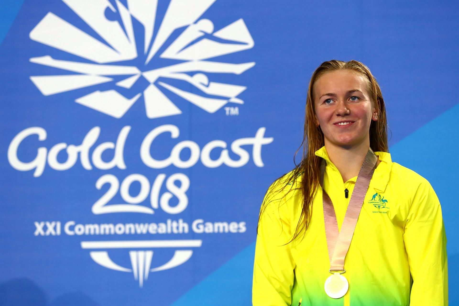 Titmus donning the Australia jacket with her 800m freestyle gold medal during the Gold Coast 2018 Commonwealth Games (Image via: Getty Images)