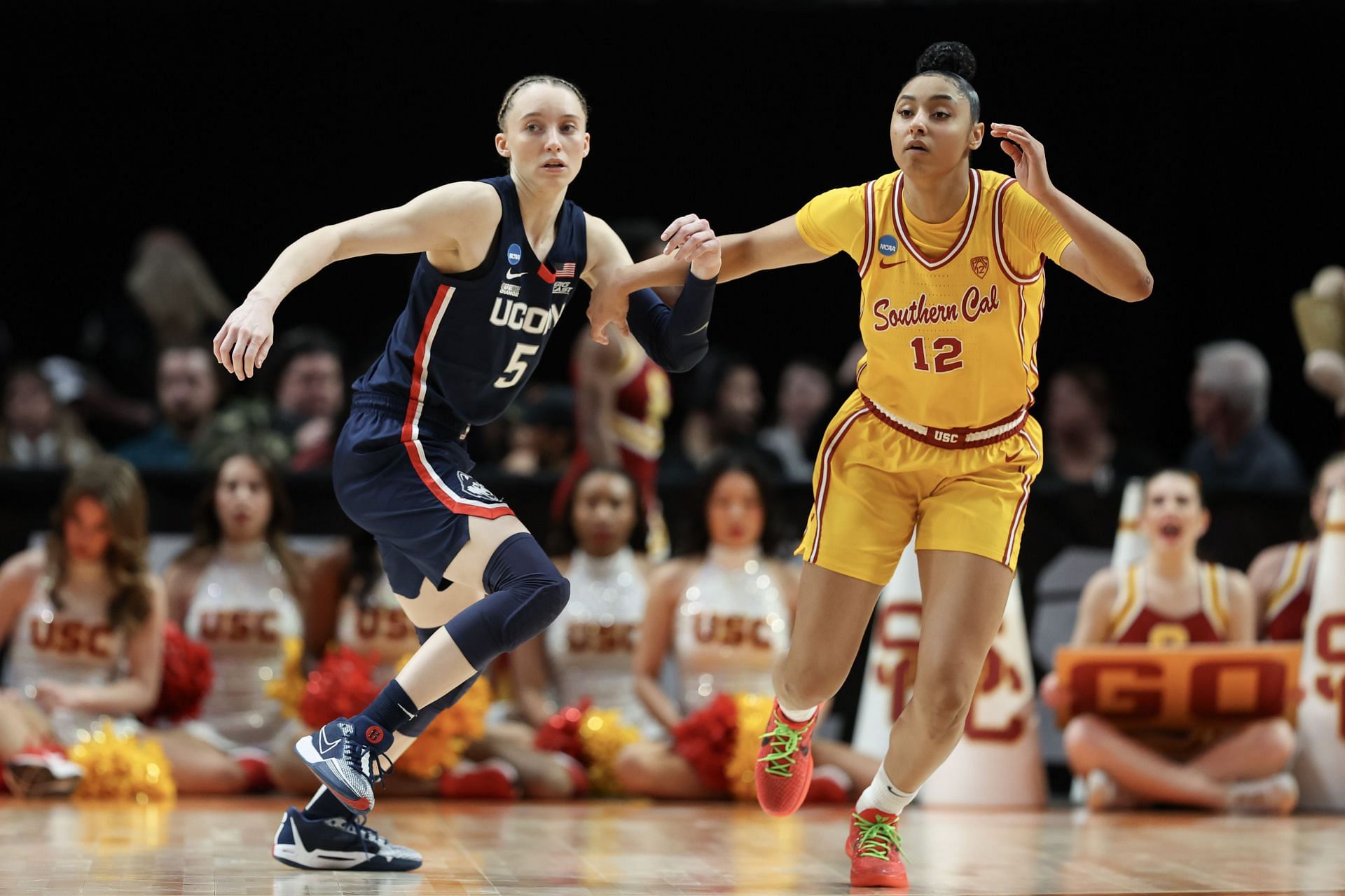 Paige Bueckers #5 of the Connecticut Huskies defends &lt;a href=&#039;https://www.sportskeeda.com/college-basketball/juju-watkins&#039; target=&#039;_blank&#039; rel=&#039;noopener noreferrer&#039;&gt;JuJu Watkins&lt;/a&gt; #12 of the USC Trojans during the second half in the Elite 8 round of the NCAA Women&#039;s Basketball Tournament at Moda Center on April 01, 2024 in Portland, Oregon. - Source: Getty