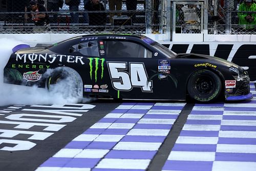 Ty Gibbs, driver of the #54 Monster Energy Toyota, celebrates with a burnout after winning the NASCAR Xfinity Series Dead On Tools 250 - Source: Getty Images