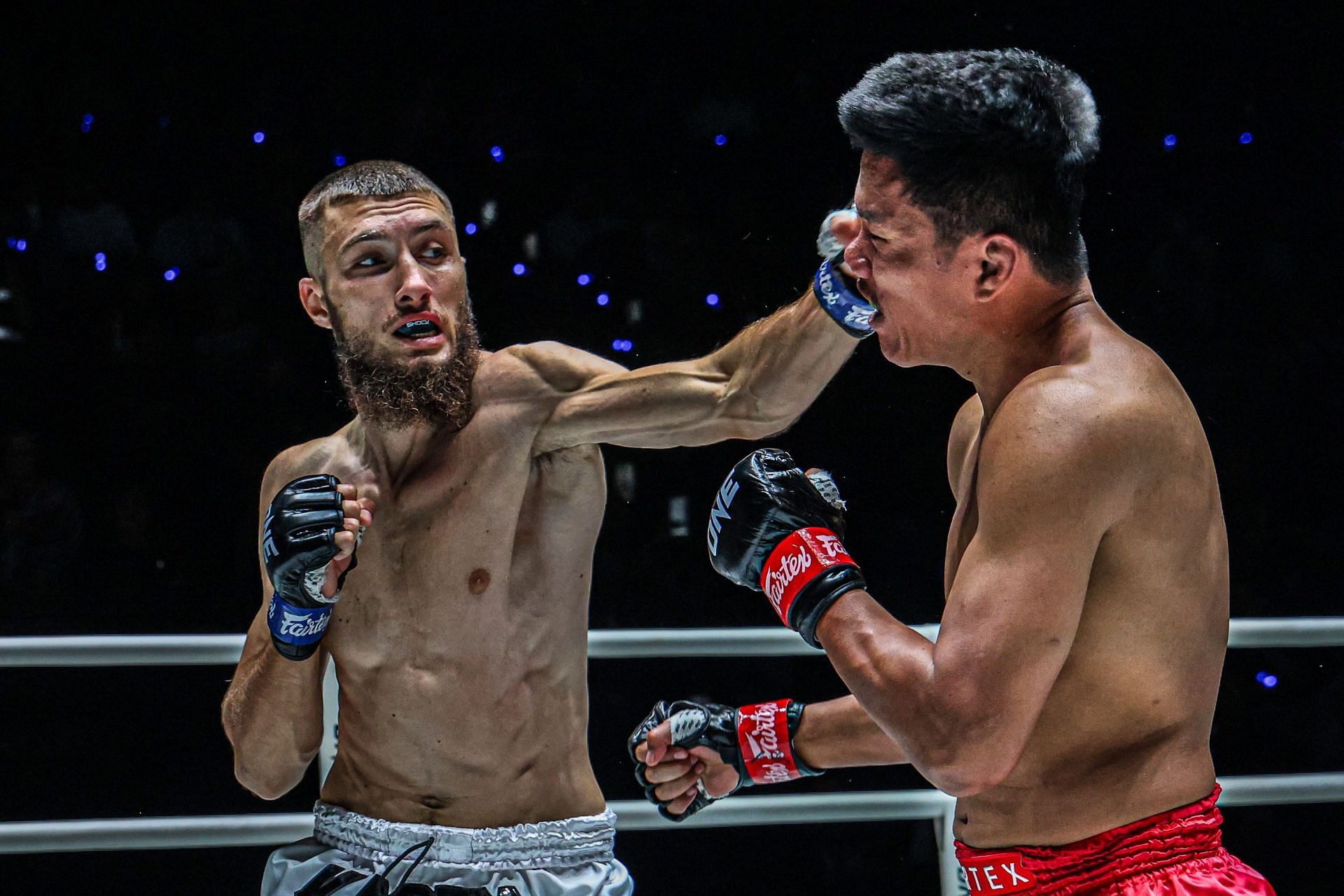 (From left) Antar Kacem catches Kongklai Sor Sommai in the main event of ONE Friday Fights 90.