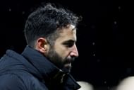 Manchester United boss Ruben Amorim looks on
