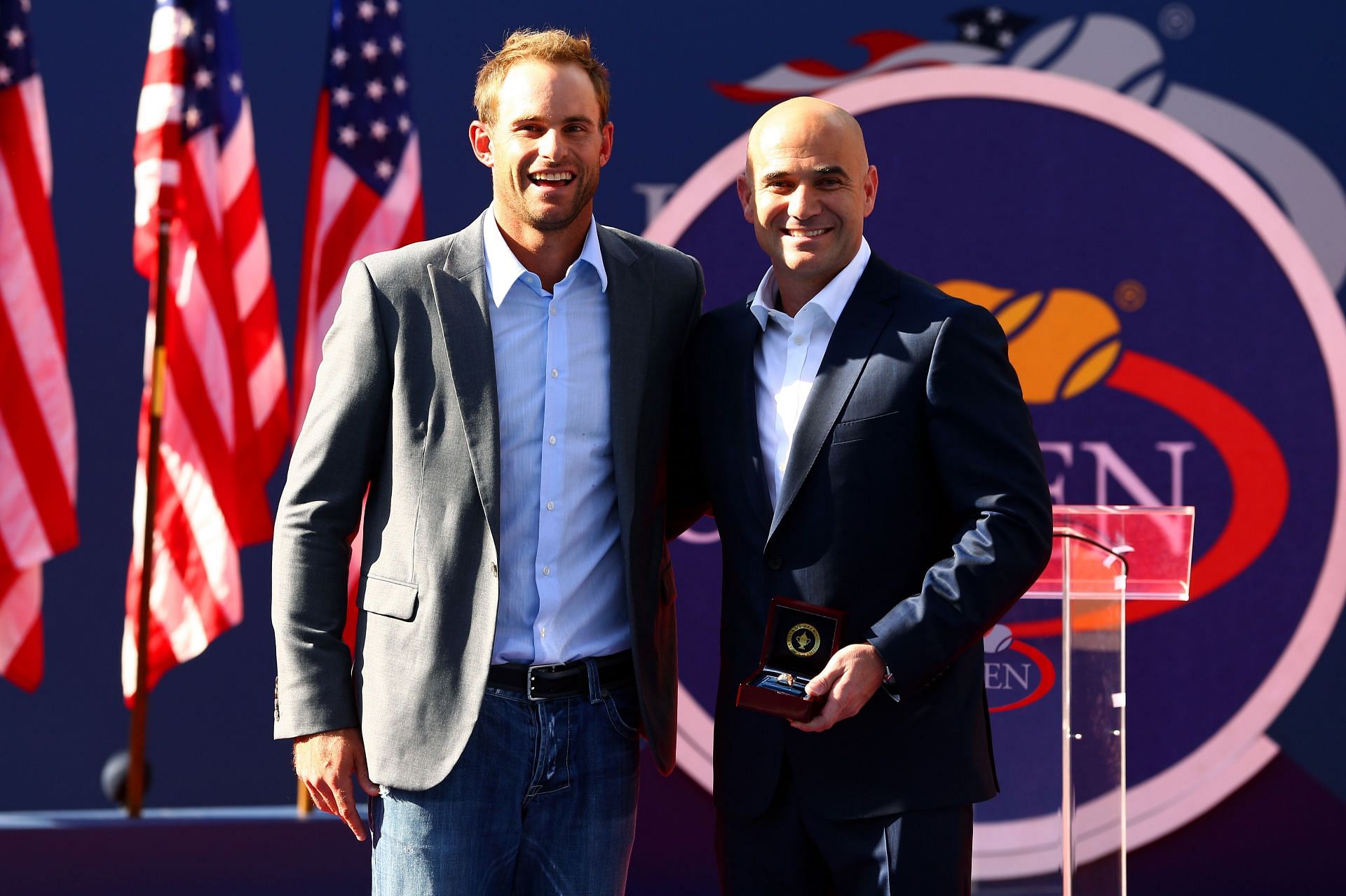 Andre Agassi poses with Andy Roddick at 2012 US Open [Source: Getty]