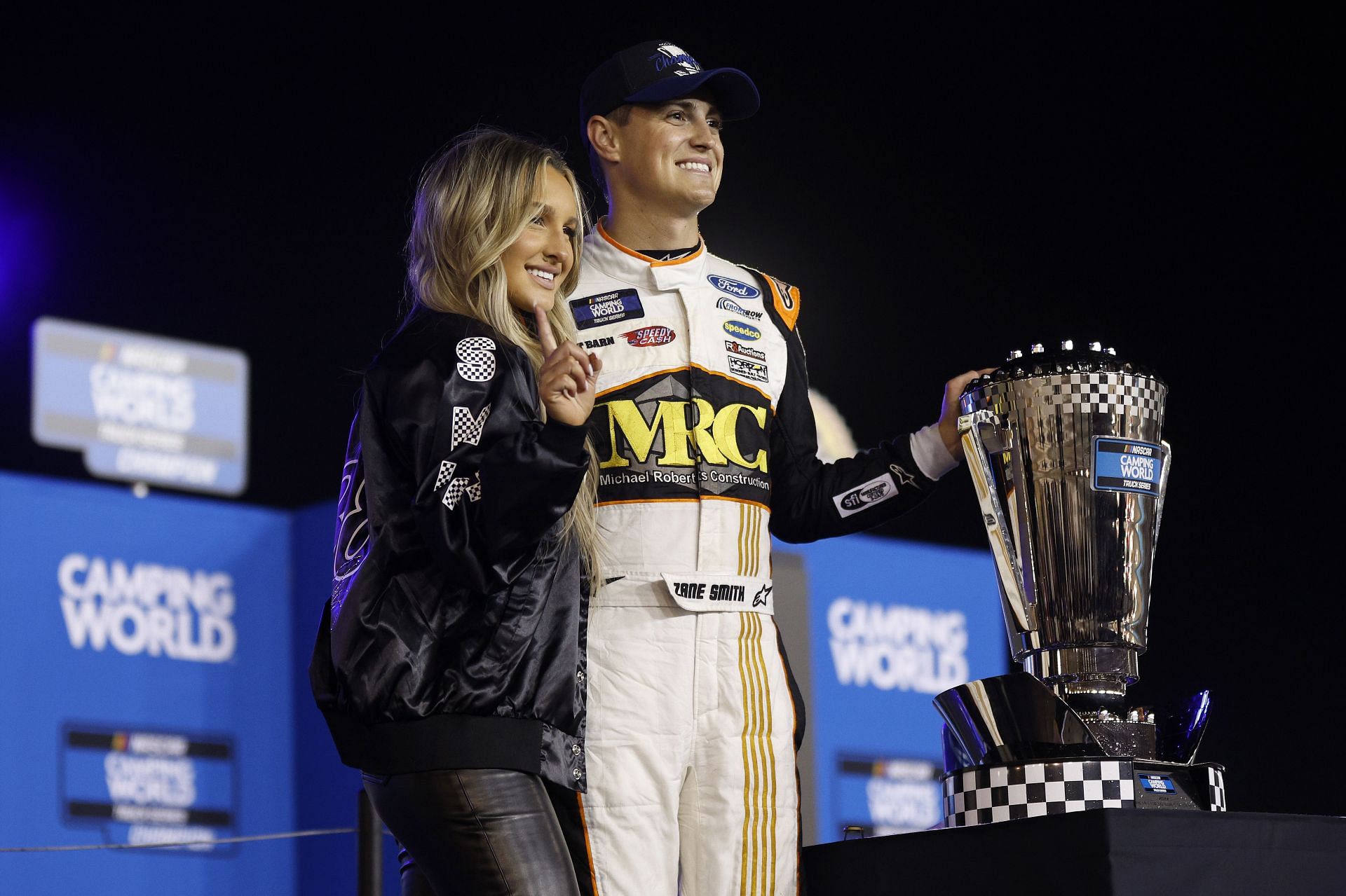 Zane Smith celebrates with his girlfriend, McCall Gaulding after winning the 2022 NASCAR Camping World Truck Series Championship - Source: Getty