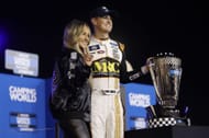 Zane Smith celebrates with his girlfriend, McCall Gaulding after winning the 2022 NASCAR Camping World Truck Series Championship - Source: Getty
