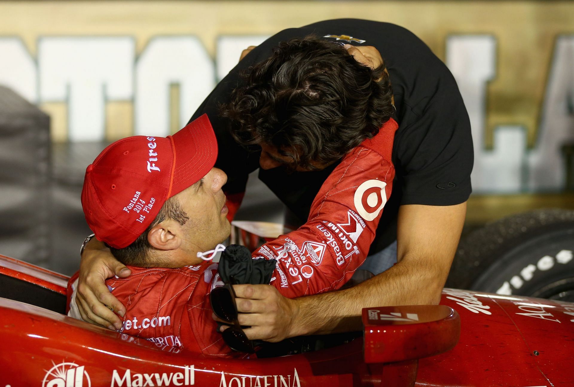 Tony Kanaan hugs Dario Franchitti at the 2014 MAVTV 500 - Day 2 - Source: Getty