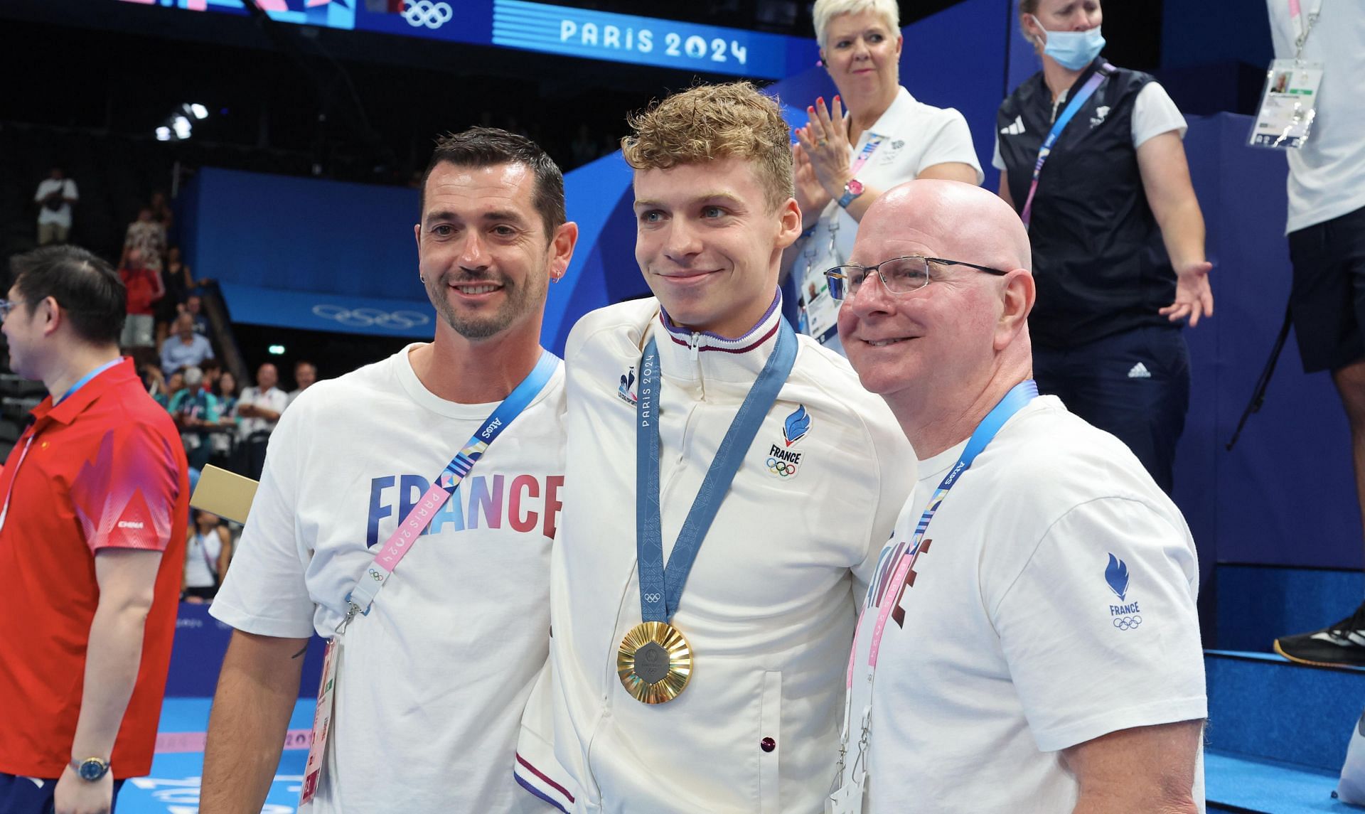 Leon Marchand and Bob Bowman (Photo by Xavier Laine/Getty Images)