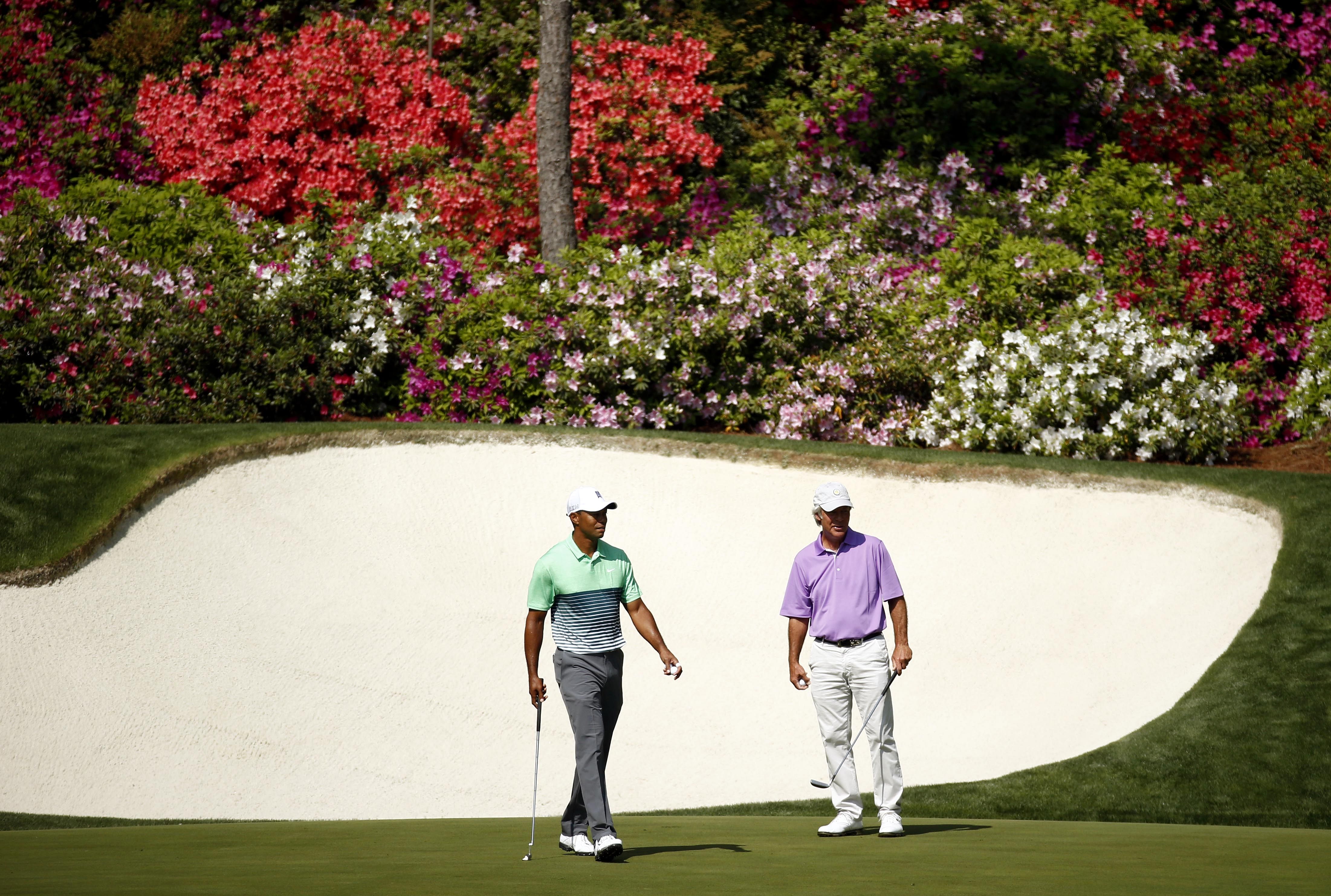 ; Tiger Woods (left) and Ben Crenshaw (right) in preparation for The Masters golf tournament 2015 - Source: Imagn