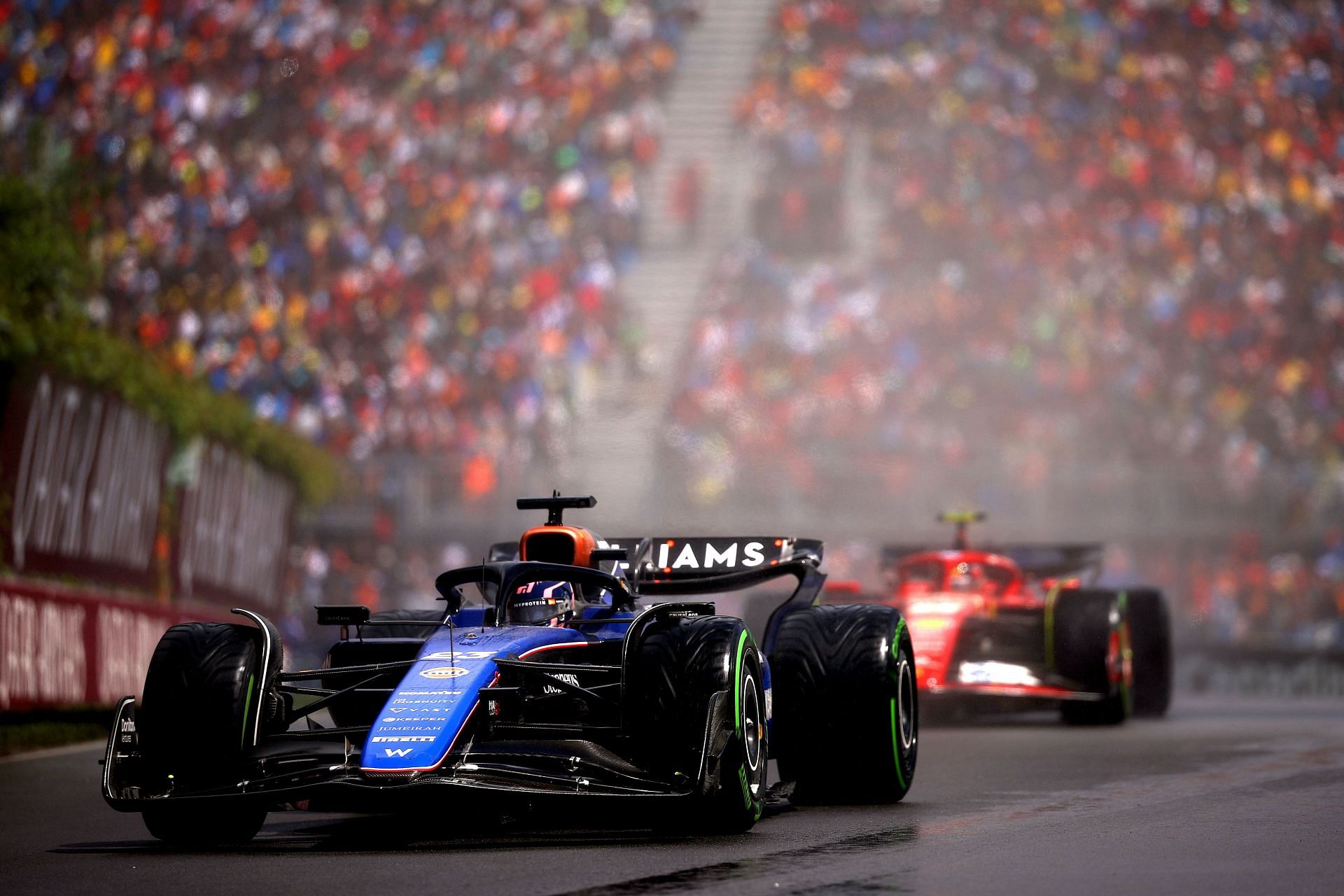 Alex Albon driving ahead of Carlos Sainz in Montreal, Canada earlier this year - Source: Getty