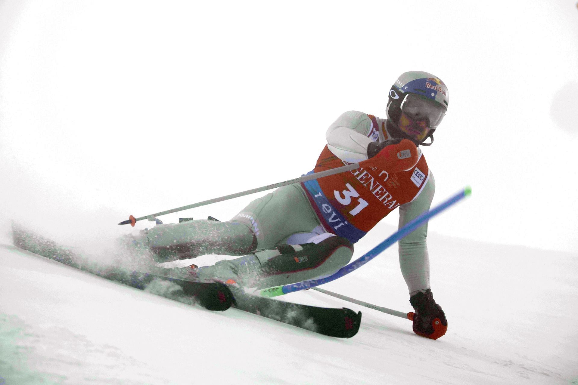 Hirscher competing for his team Netherlands in a red and white skiing suit during a slalom event in Levi, Finland (Image via: Getty Images)