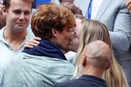 Jannik Sinner and Anna Kalinskaya share a kiss at the 2024 US Open - Image Source: Getty