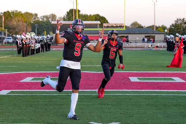 Bellefontaine QB Tavien St. Claire #9 during a game. Image via @TJSaint_1 on X