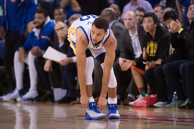 Under Armour's Steph Curry signs comedian Desi Banks' Nike Air Force sneakers on one condition