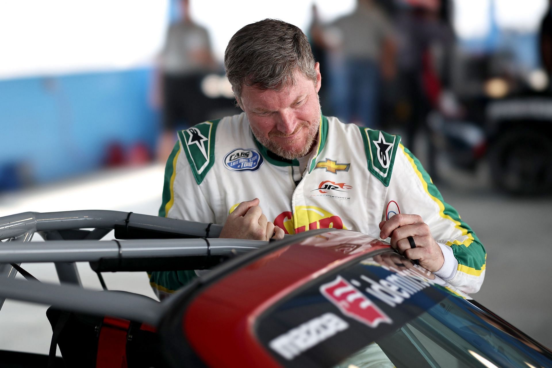 NASCAR Hall of Famer Dale Earnhardt Jr. climbs into a Mazda MX-5 Cup race car during the Mazda MX-5 Cup Test at Martinsville Speedway - Source: Getty Images