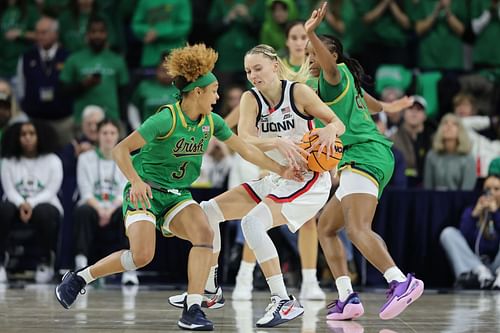 Hannah Hidalgo (#3) of the Notre Dame Fighting Irish attempts to steal the ball from Paige Bueckers (#5) of the UConn Huskies during the second half of their NCAA game on December 12, 2024. Photo: Getty