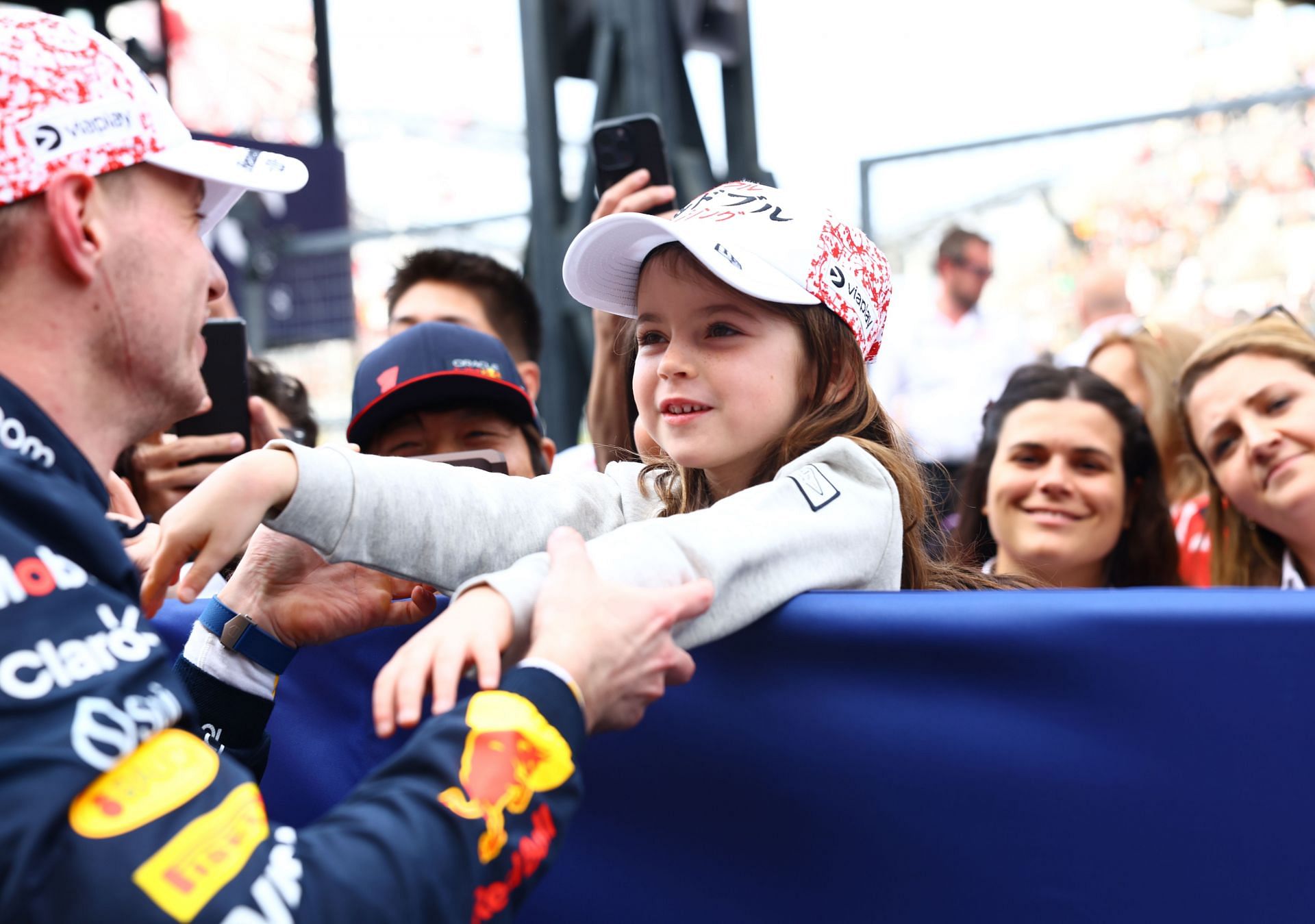 Race winner Max Verstappen of the Netherlands and Oracle Red Bull Racing celebrates with Penelope Piquet - Source: Getty