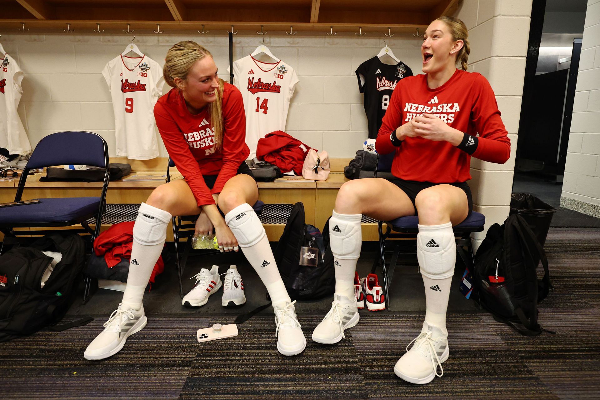 Jackson (right) sitting beside her teammate in the dressing room during the 2023 NCAA Gymnastics Championships (Image via: Getty Images)