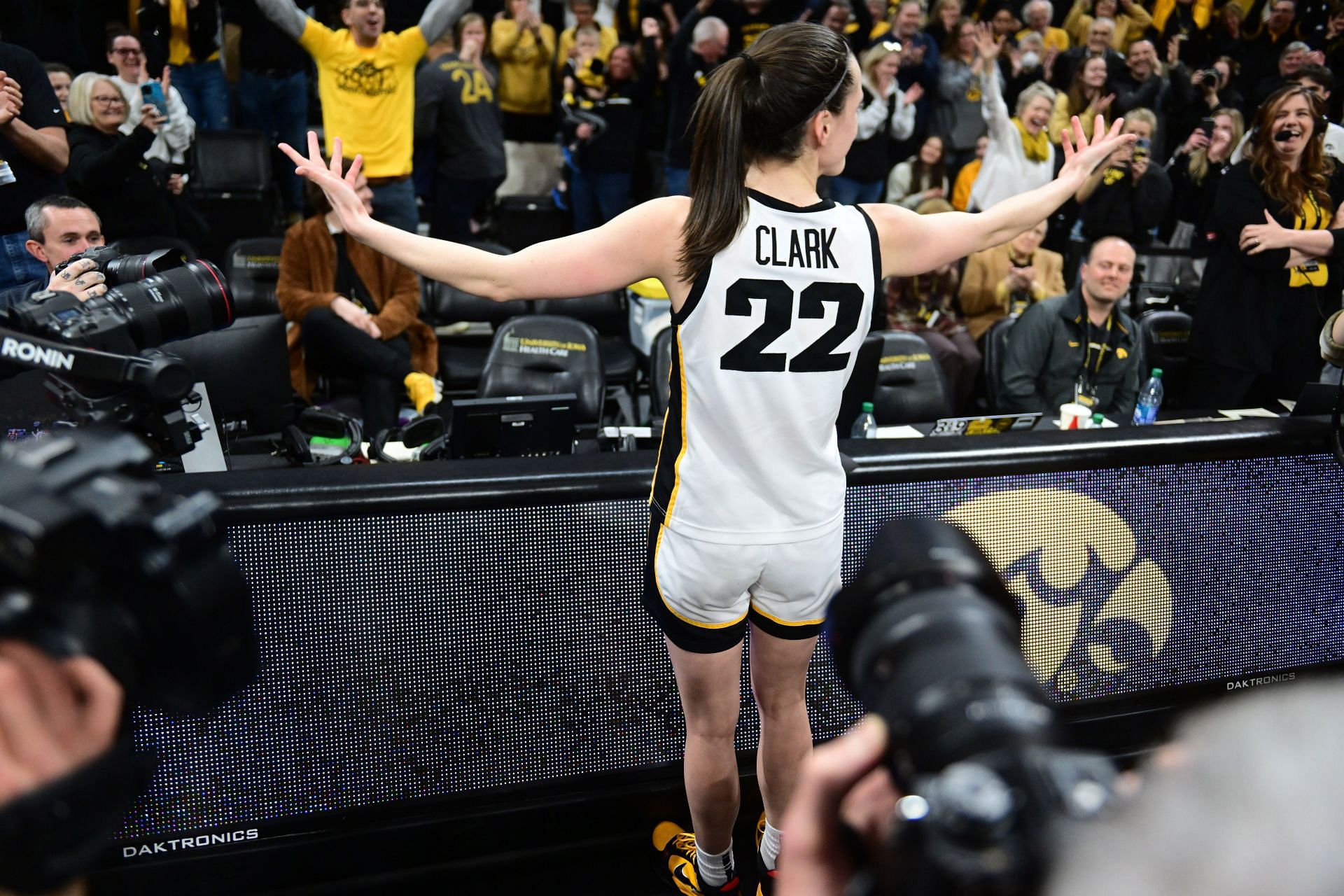 Iowa Hawkeyes guard Caitlin Clark (#22) celebrates with the Iowa fans after scoring the game-winning buzzer-beater against the Indiana Hoosiers on February 26, 2023, at Carver-Hawkeye Arena. Photo: Getty