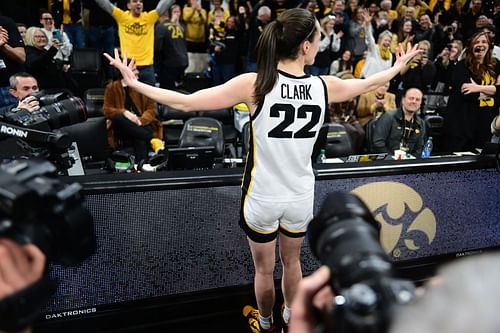 Iowa Hawkeyes guard Caitlin Clark (#22) celebrates with the Iowa fans after scoring the game-winning buzzer-beater against the Indiana Hoosiers on February 26, 2023, at Carver-Hawkeye Arena. Photo: Getty