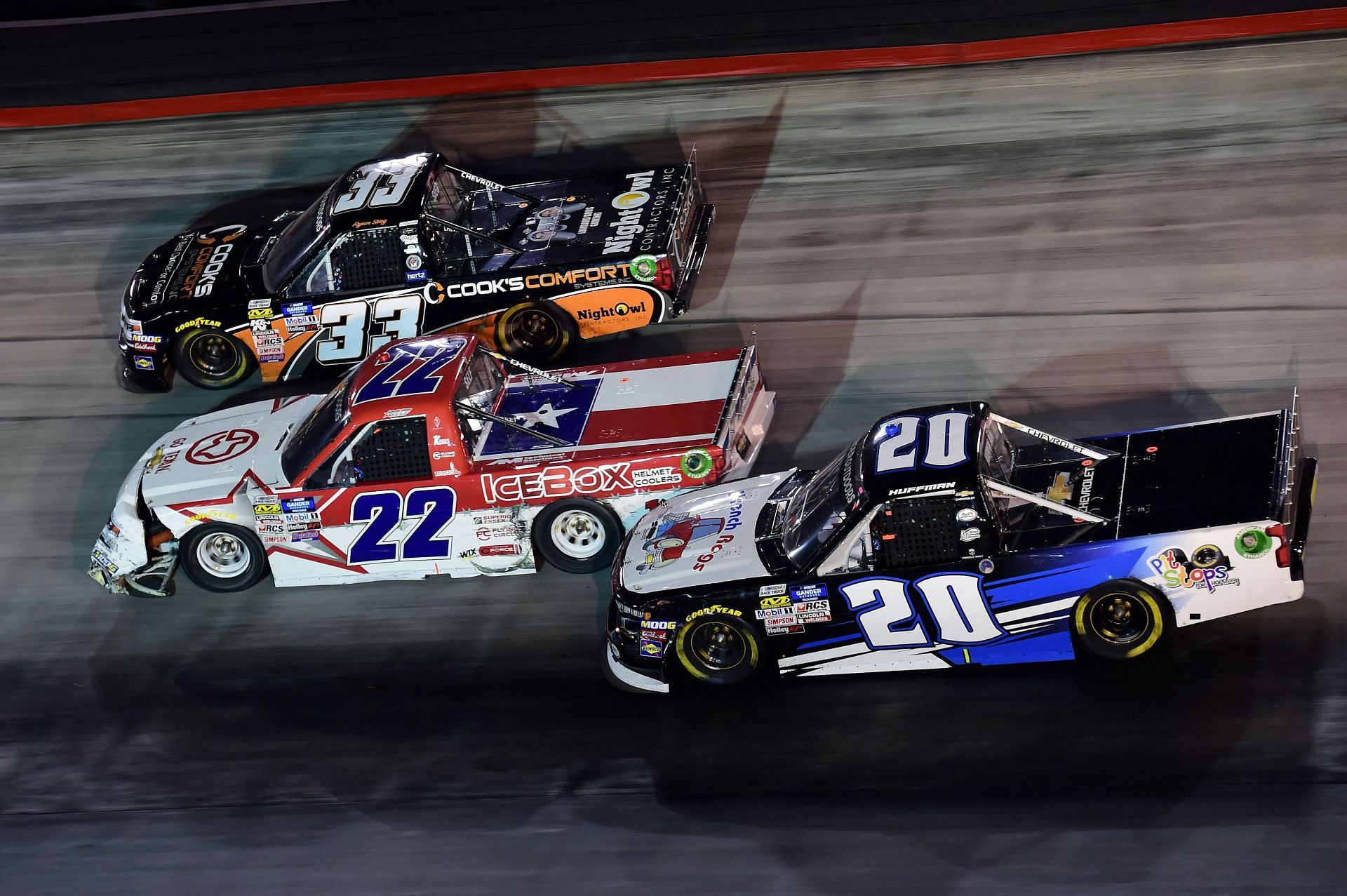 Ryan Sieg, driver of the #33 Cook&#039;s Comfort System Chevrolet, Austin Wayne Self, driver of the #22 GO TEXAN Chevrolet, and Landon Huffman, driver of the #20 PitStopsForHope.org/Wrench Rags Chevrolet, race during the NASCAR Gander Outdoor Truck Series UNOH 200 - Source: Getty