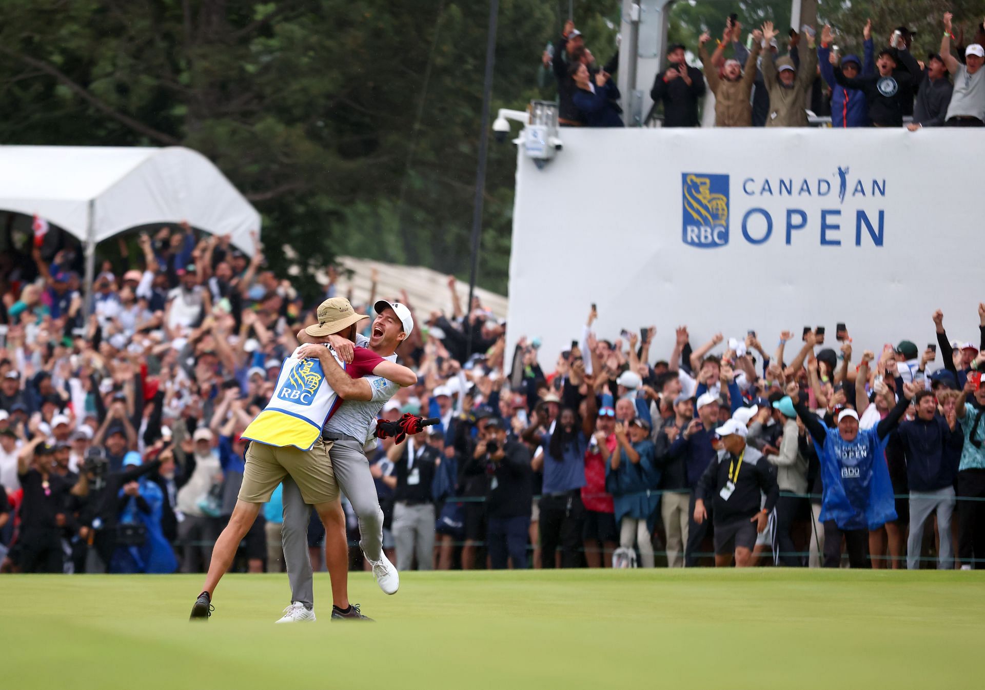  Nick Taylor celebrates with his caddie after winning the RBC Canadian Open 2023 - Source: Getty