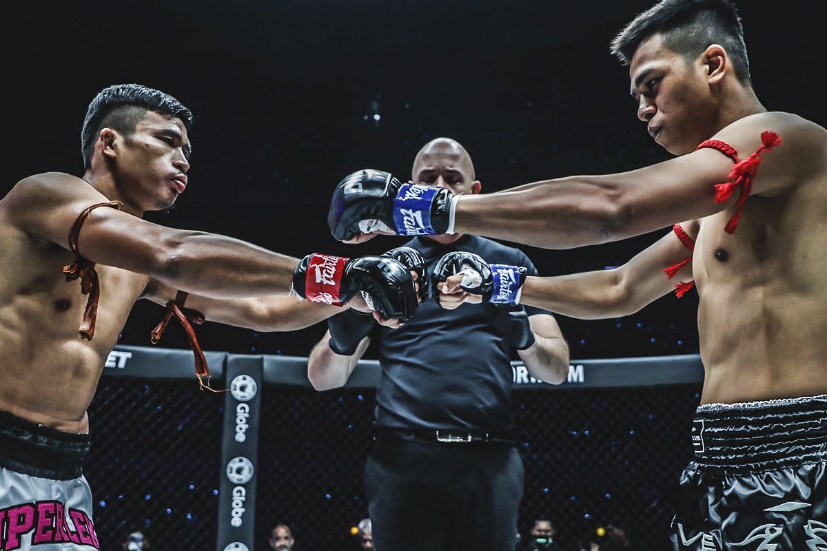 Superlek Kiatmoo9 and Panpayak touching gloves | Image credit: ONE Championship