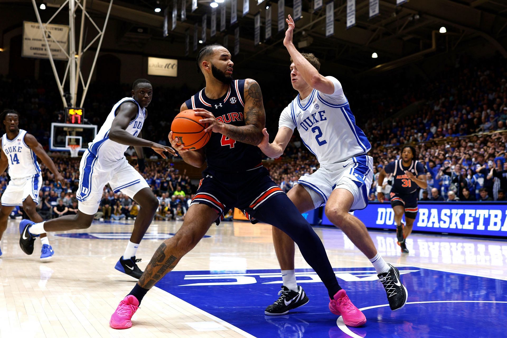 Johni Broome (#4) of the Auburn Tigers moves the ball against Cooper Flagg (#2) of the Duke Blue Devils during the second half of their NCAA game. Photo: Getty