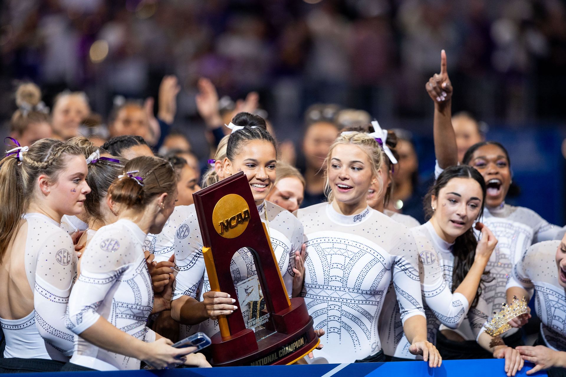 Dunne with the trophy at the 2024 NCAA Division I Women&#039;s Gymnastics Championships - (Source: Getty)