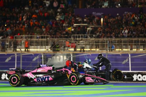 Esteban Ocon of France and Alpine F1 and Franco Colapinto of Argentina and Williams climb out of their cars after crashing at the start during the F1 Grand Prix of Qatar - Source: Getty Images