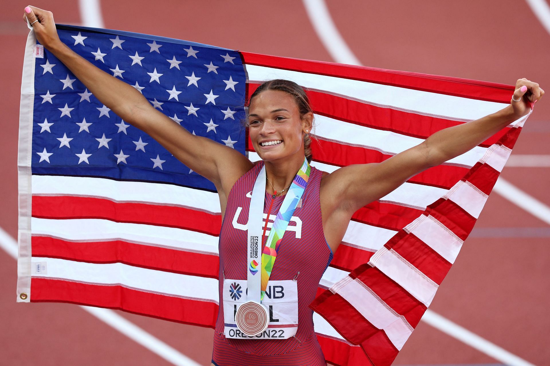 Hall at Hayward Field celebrating with the United States flag after winning the heptathlon bronze medal on the fourth day of the 2022 World Championships (Image via: Getty Images)