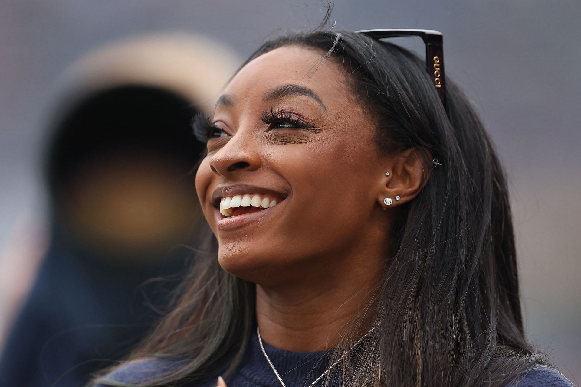 Simone Biles reacting to the Los Angeles Rams v Chicago Bears - (Source: Getty)