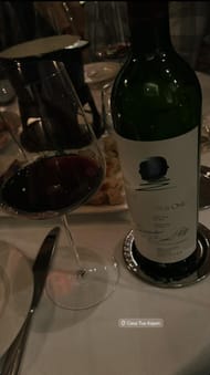 Gianna Tulio and Ryan Blaney's wine at dinner table (Source: @giannatulio via Instagram)