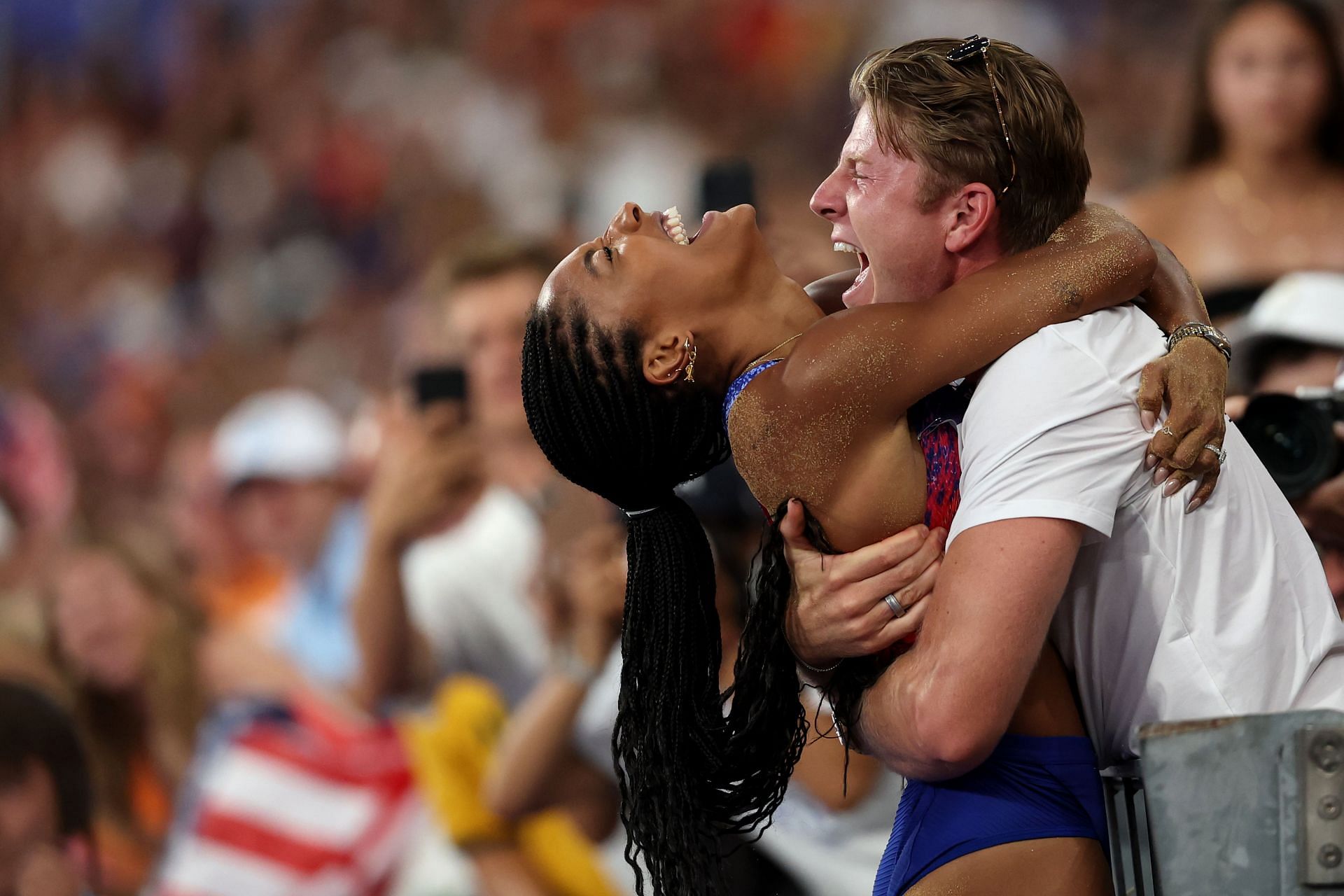 Tara Davis-Woodhall of Team United States celebrates with her husband Hunter Woodhall at the Olympic Games 2024 in Paris, France. (Photo by Getty Images)