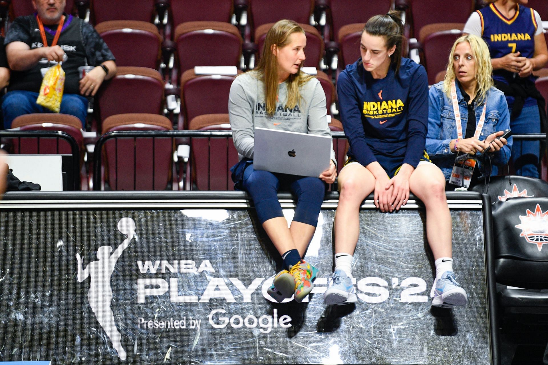 Indiana Fever guard Caitlin Clark (22) takes instructions before a game against the Connecticut Sun (Credits: Getty)