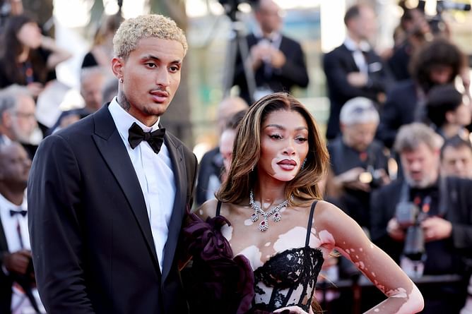Kyle Kuzma's girlfriend Winnie Harlow turns heads in all-black outfit while linking up with Serena Williams & Simone Biles at Ademars Piguet event