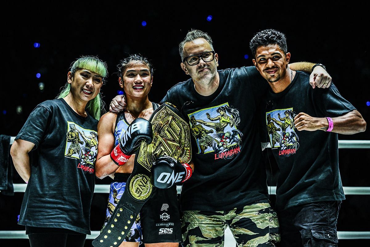 Jackie Buntan posing with her team after ONE 169 victory. [Photo via: ONE Championship]