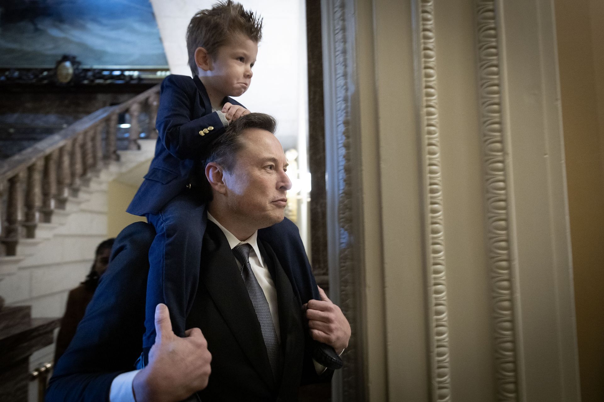 Elon Musk with his son X &AElig; A-Xii, whom he shares with Grimes, (Photo by Win McNamee/Getty Images)