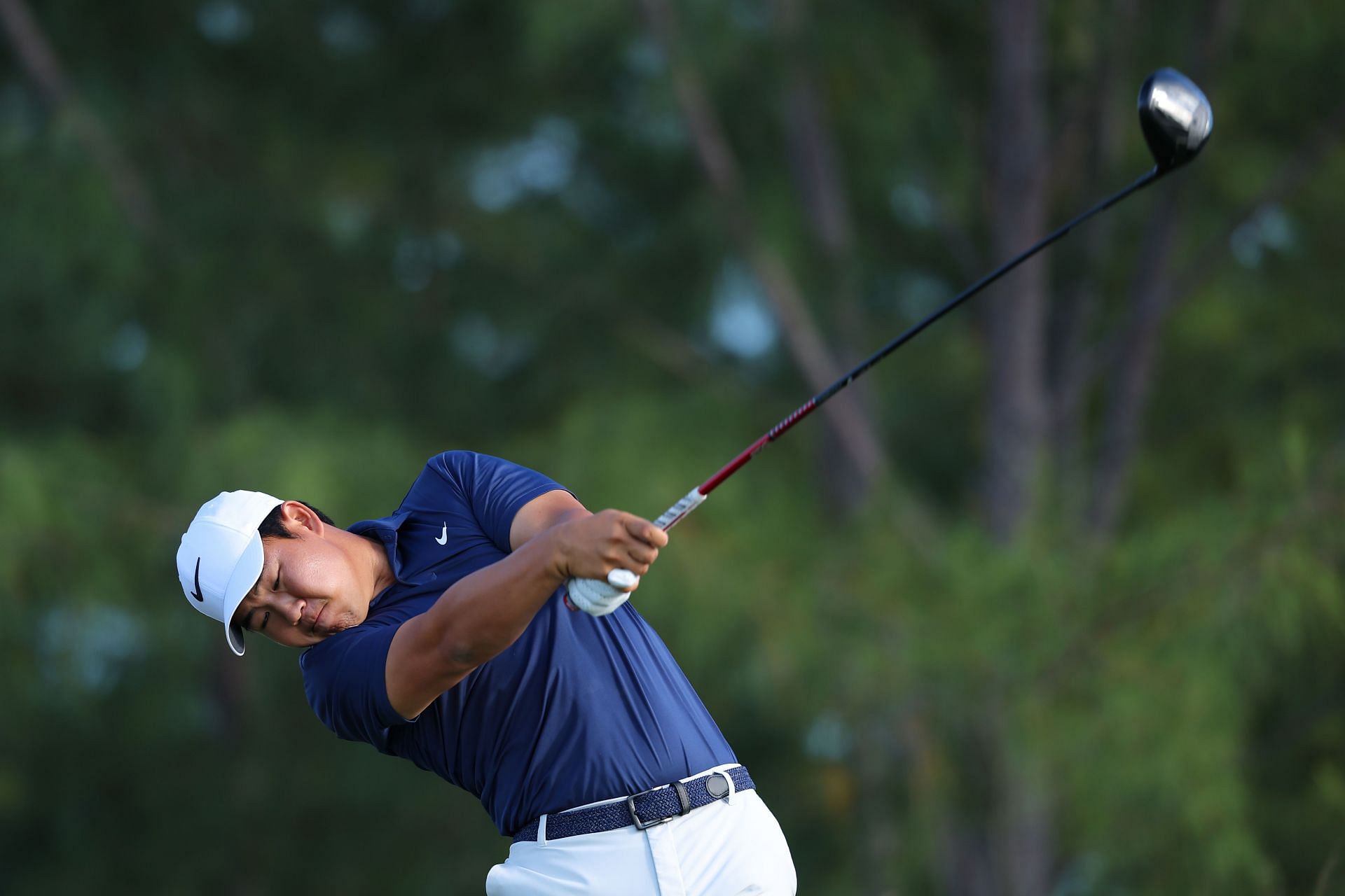 Tom Kim plays his shot from the 13th tee during the final round of the Hero World Challenge (Image Source: Getty)