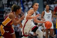 Azzi Fudd (#35) of the Connecticut Huskies is defended by Malia Samuels (#10) of the USC Trojans during the first half of their NCAA women's basketball game at the XL Center on December 21, 2024 in Hartford, Connecticut (Credits: Getty)