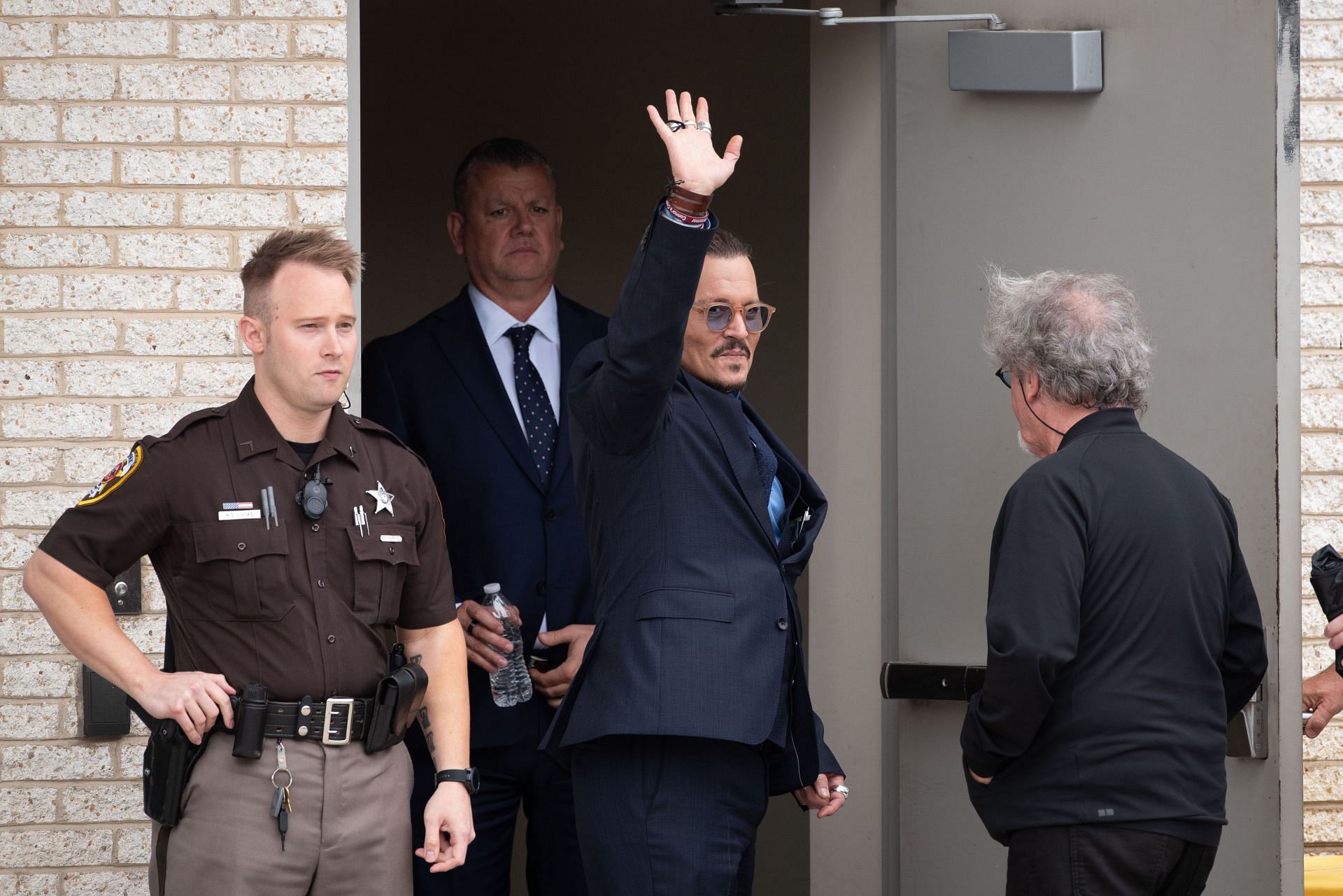 Johnny Depp seen waving to fans outside the courthouse (Image via Getty)