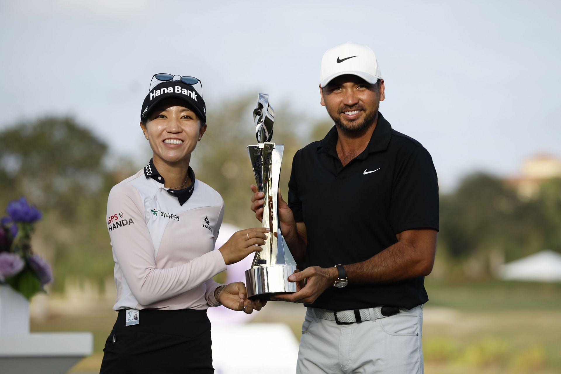 Lydia Ko and Jason Day celebrate with the trophy after winning during the final round of the 2023 Grant Thornton Invitational (Image Source: Getty)