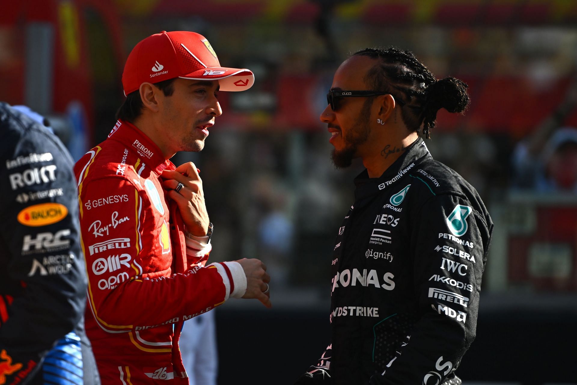 Charles Leclerc (L) and Lewis Hamilton talk before the F1 Grand Prix of Abu Dhabi - Source: Getty