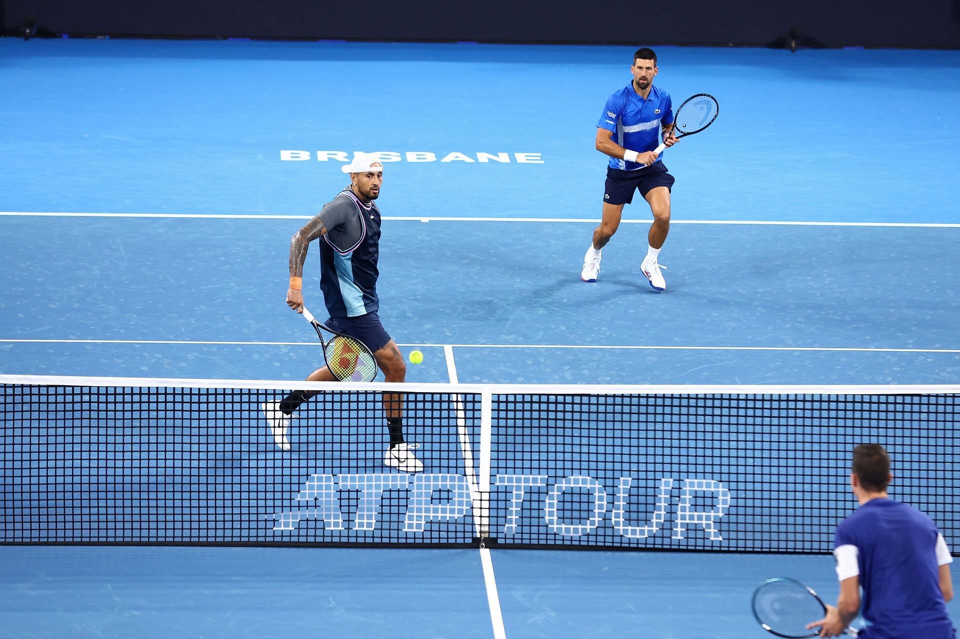 Novak Djokovic (R) and Nick Kyrgios in action during their doubles encounter at the 2025 Brisbane International. (Source: Getty)