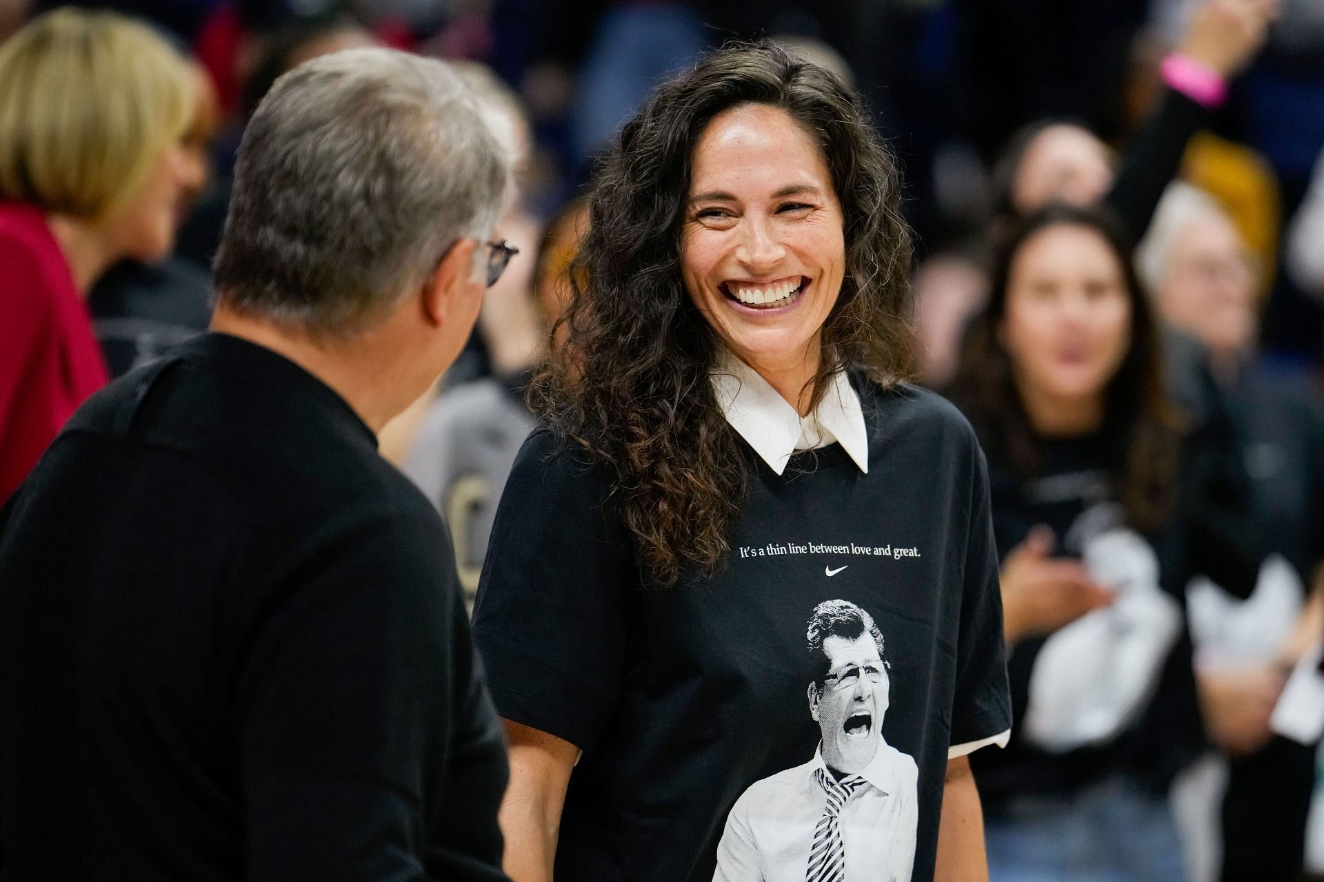 Sue Bird speaks with UConn Huskies head coach Geno Auriemma during an event celebrating his all-time NCAA basketball wins record at the Harry A. Gampel Pavilion in Storrs, Connecticut. Photo: Getty