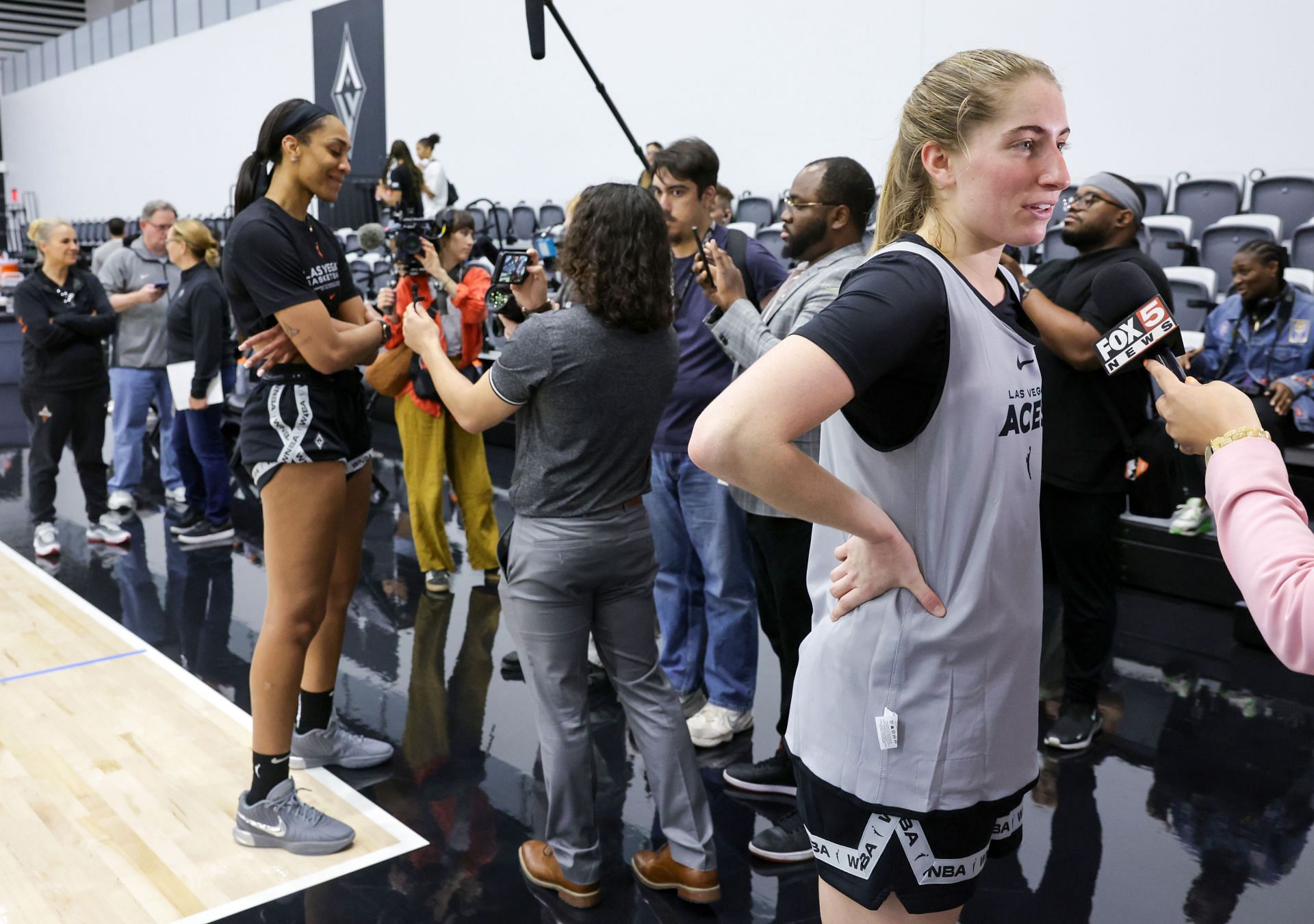 A&#039;ja Wilson (L) #22 and Kate Martin #20 of the Las Vegas Aces are interviewed during the team&#039;s first day of training camp at Las Vegas Aces Headquarters - Source: Getty