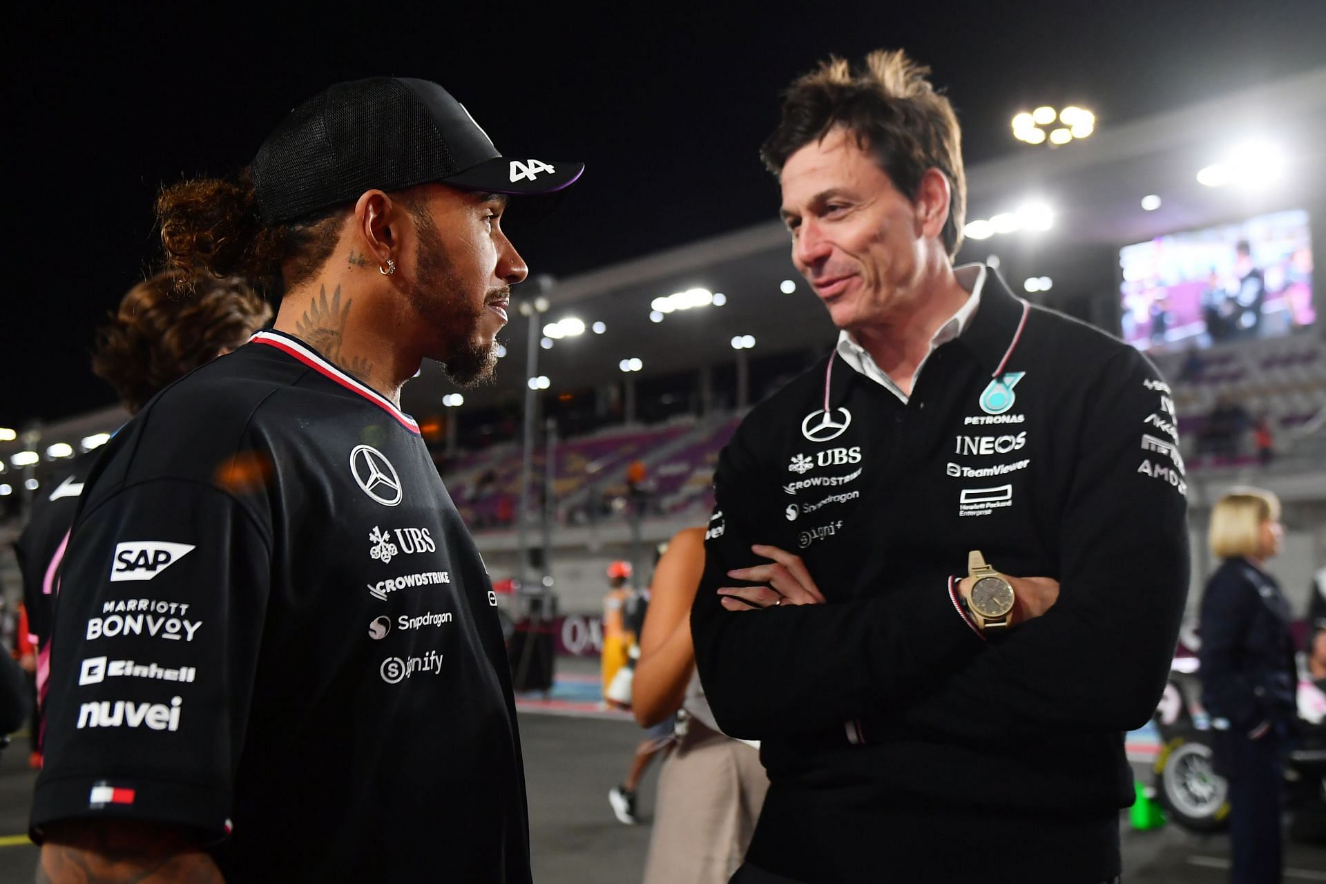 Lewis Hamilton of Great Britain and Mercedes and Mercedes GP Executive Director Toto Wolff talk on the grid during a race weekend - Source: Getty Images