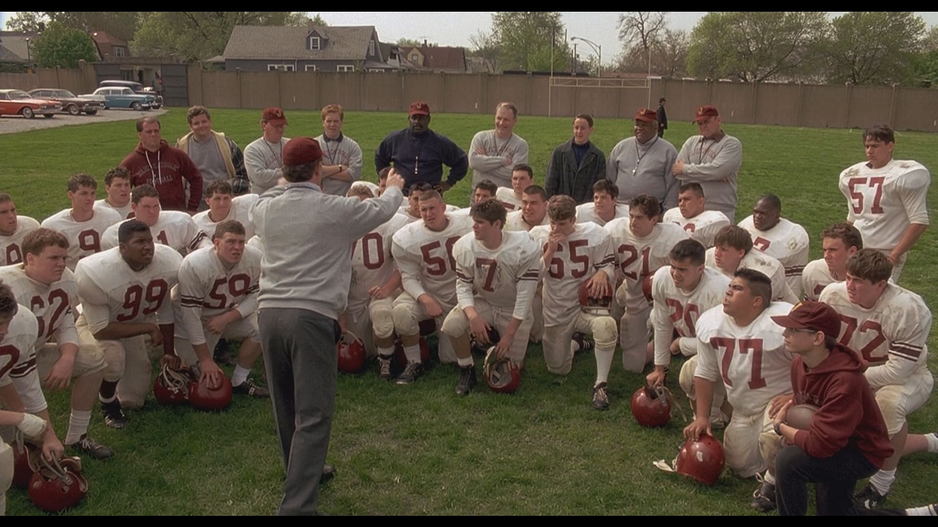 Talking to the players in Rudy. (Image via Apple TV)