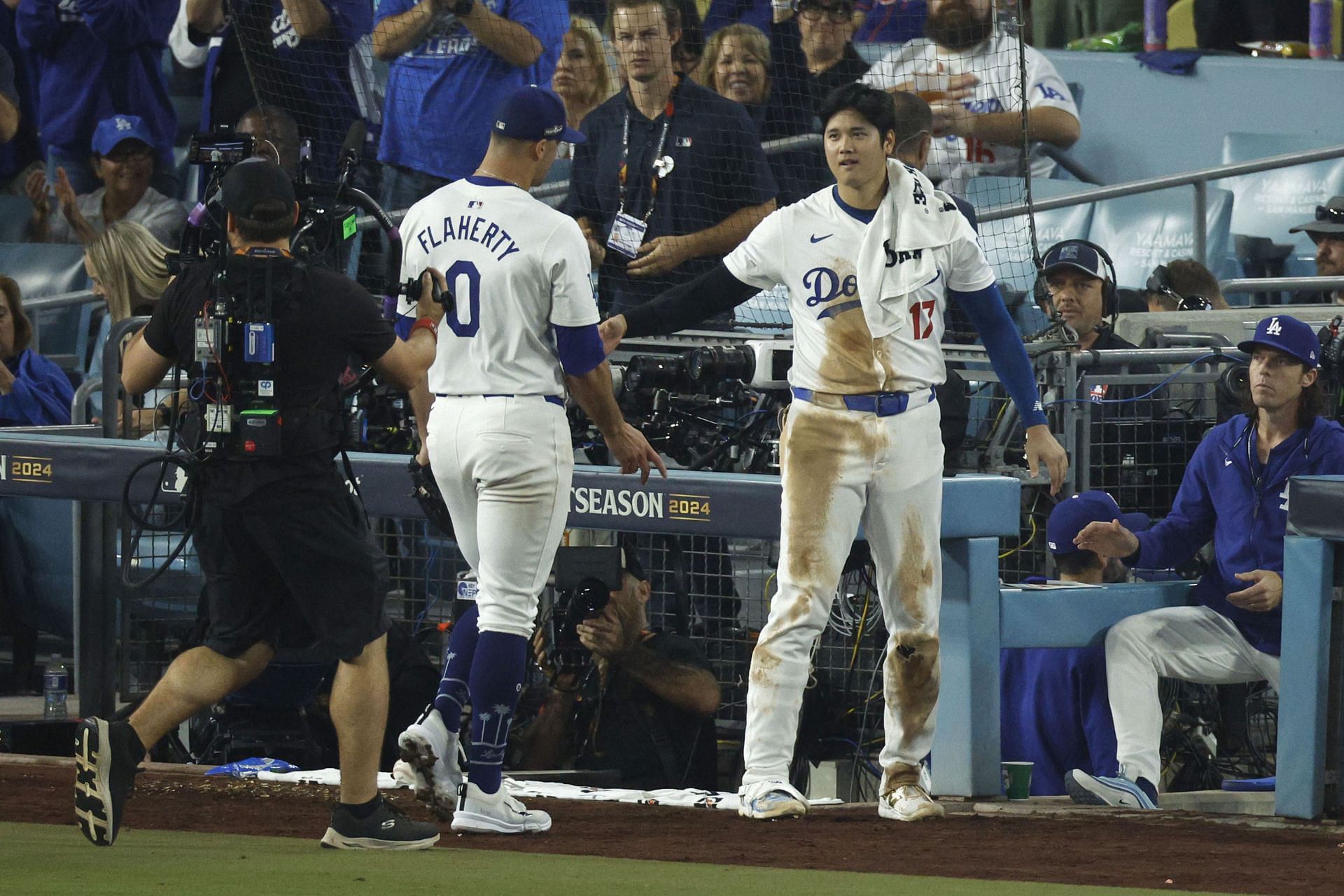 LOS ANGELES, CALIFORNIA - OCTOBER 13: Jack Flaherty #0 and Shohei Ohtani #17 of the Los Angeles Dodgers celebrate in the seventh inning against the New York Mets during Game One of the Championship Series at Dodger Stadium on October 13, 2024 in Los Angeles, California. (Photo by Kevork Djansezian/Getty Images) - Source: Getty