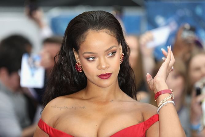 "Imagine being a grown man being a fan girl" — Internet reacts to Rihanna discouraging a fan from getting her autograph tattooed on him